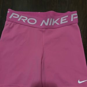 pink, 5 inch length nike pro shorts.